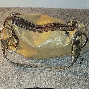 Kathy Van Zeeland Women’s Gold Shoulder Bag.Shimmery gold faux suede two strap